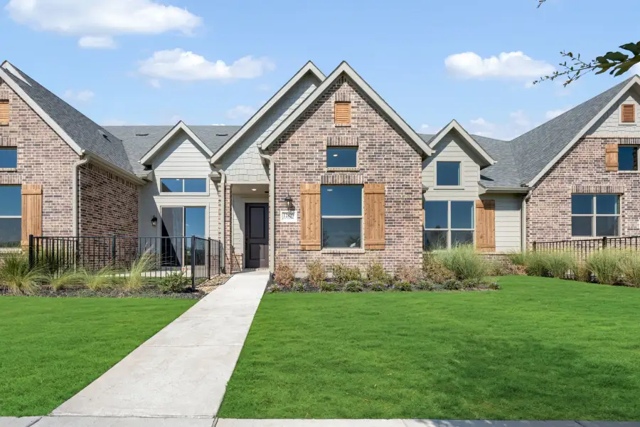Front exterior of a new home in Cottonwood Creek, Rowlett, TX, highlighting curb appeal (Image 2). Front exterior of a new home in Cottonwood Creek, Rowlett, TX, highlighting curb appeal (Image 2).