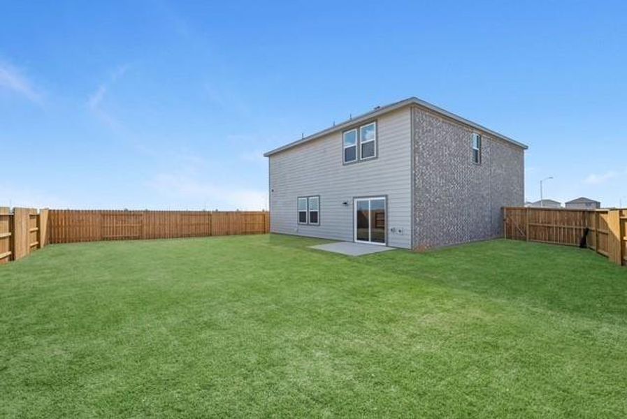 Exterior details and patio area of a home in Sunterra Lakes, Brookshire (Image 3).