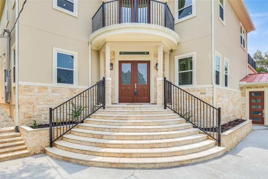 Doorway to property with french doors and a balcony