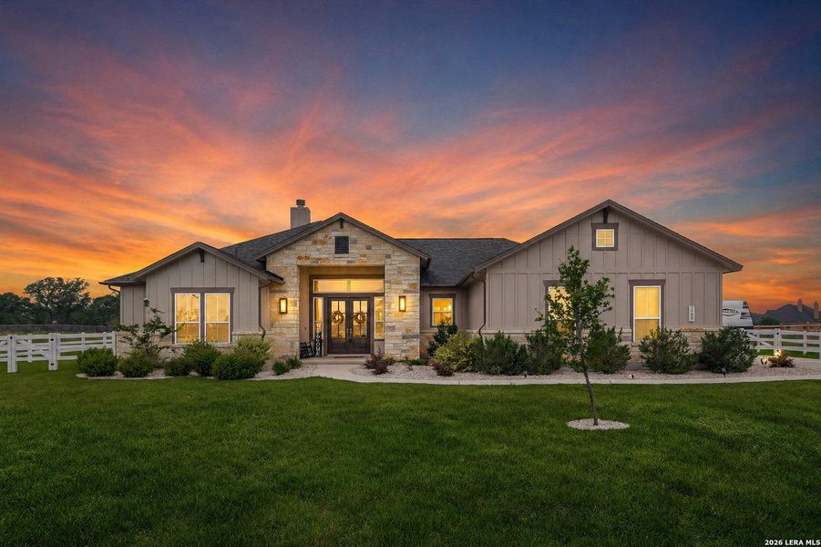 Front exterior of a new home in Pradera Ridge, Floresville, TX, highlighting curb appeal (Image 23).
