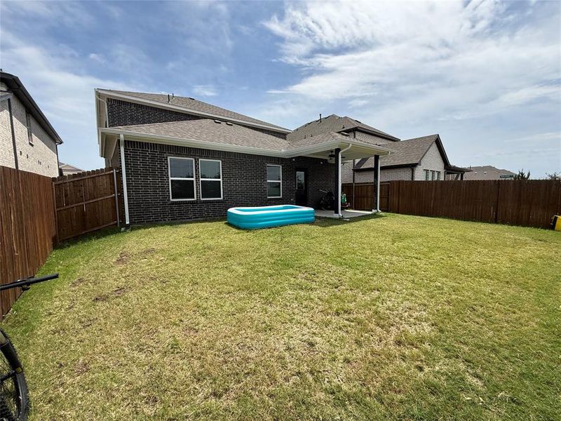 Exterior details and patio area of a home in Travis Ranch, Forney (Image 22).