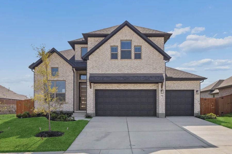 Front exterior of a new home in Las Lomas, Forney, TX, highlighting curb appeal (Image 1). Front exterior of a new home in Las Lomas, Forney, TX, highlighting curb appeal (Image 1).