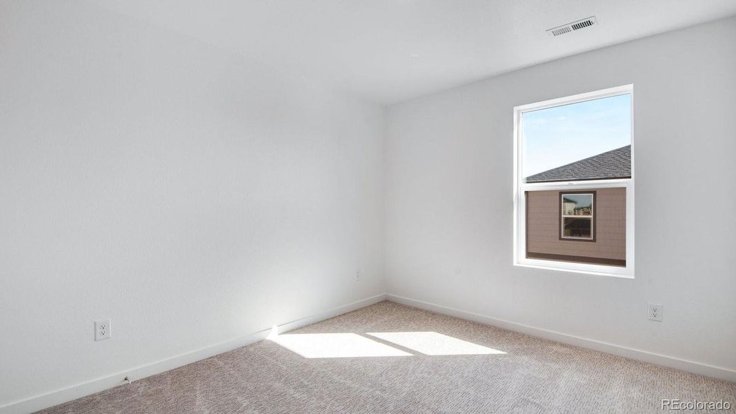 Spacious, unfurnished interior of a new home in Sky Ranch, Watkins (Image 27).