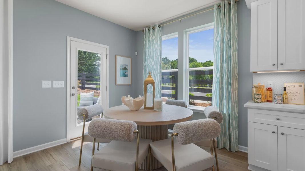 Bright breakfast area in new construction townhome featuring large windows and abundant natural light. Bright breakfast area in new construction townhome featuring large windows and abundant natural light.