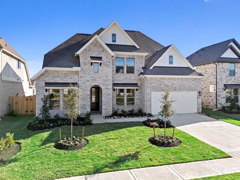 Front exterior of a new home in The Meadows at Imperial Oaks 60', Conroe, TX, highlighting curb appeal (Image 20).