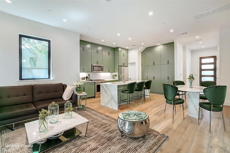 Living area featuring light wood-type flooring and recessed lighting