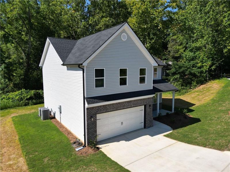 Front exterior of a new home in , Temple, GA, highlighting curb appeal (Image 2).
