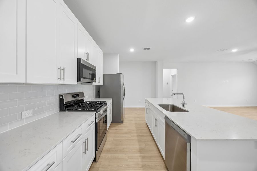 Kitchen in the Heisman home plan by Trophy Signature Homes – REPRESENTATIVE PHOTO Kitchen in the Heisman home plan by Trophy Signature Homes – REPRESENTATIVE PHOTO