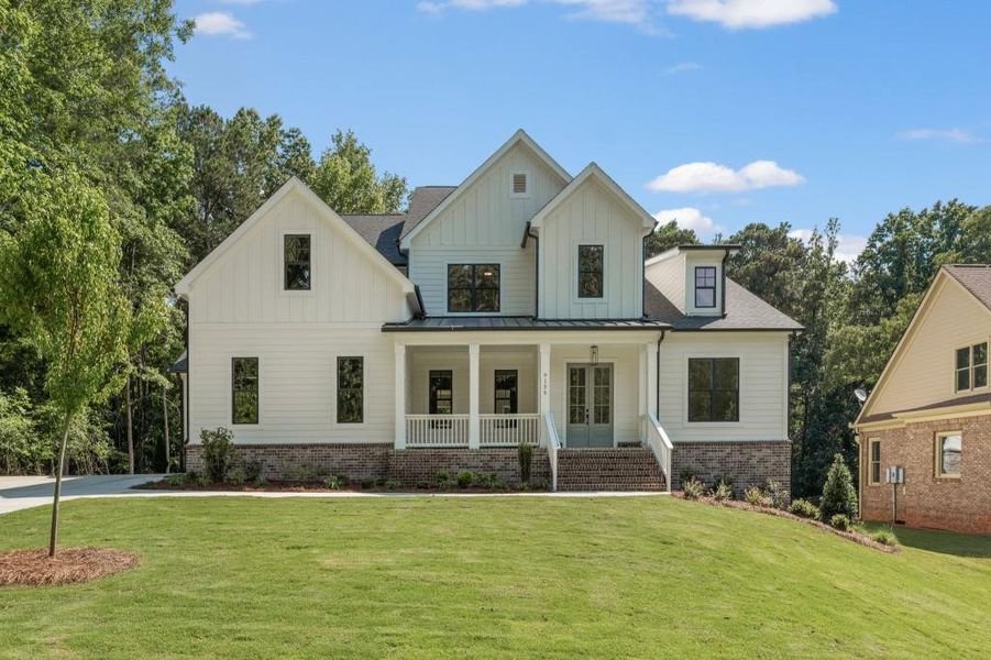 Front exterior of a new home in White Post on Lake Lanier, Gainesville, GA, highlighting curb appeal (Image 19).
