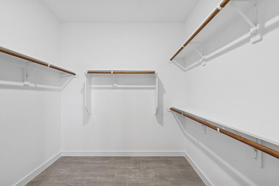 Primary walk-in closet (*Photo not of actual home and used for illustration purposes only.)