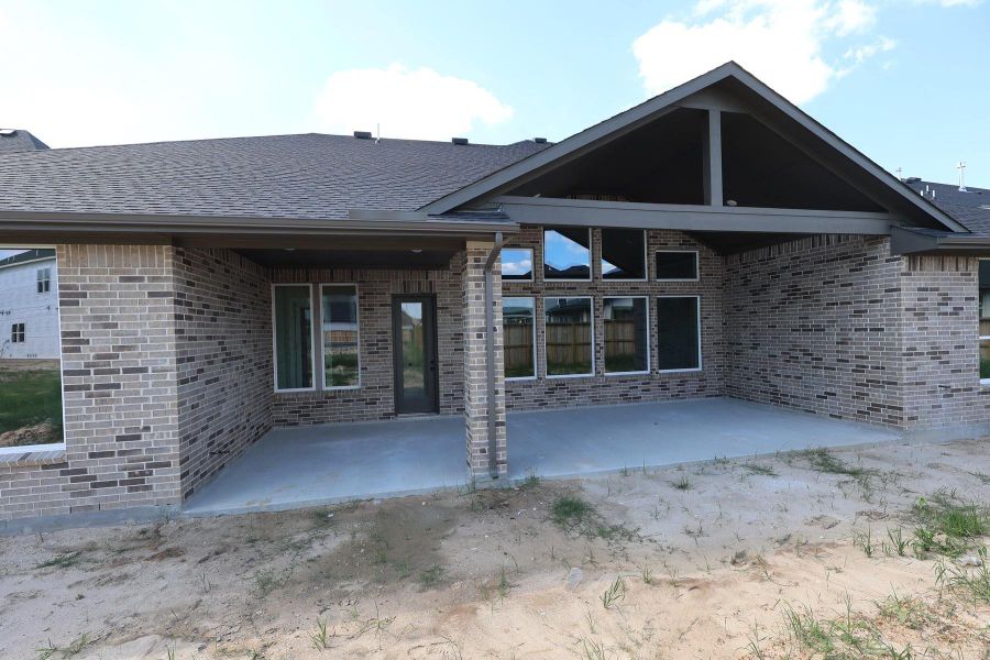 Exterior details and patio area of a home in Dunham Pointe, Cypress (Image 19).