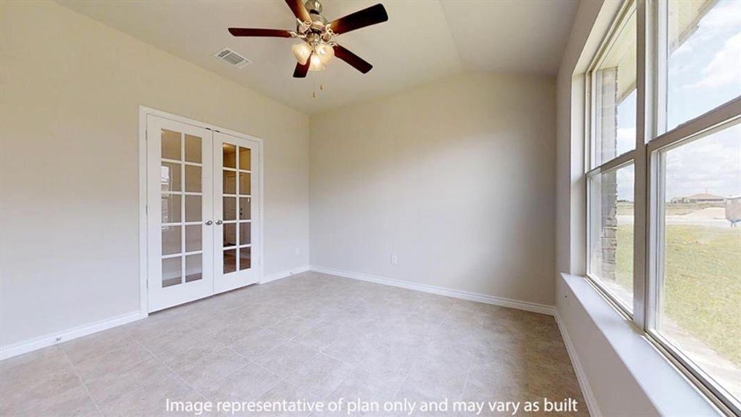 Unfurnished room featuring french doors, ceiling fan, and lofted ceiling Unfurnished room featuring french doors, ceiling fan, and lofted ceiling