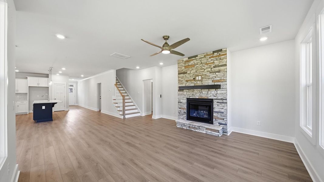 Elegant family room featuring hardwood flooring, large windows, and thoughtful architectural detail near Lake Hartwell