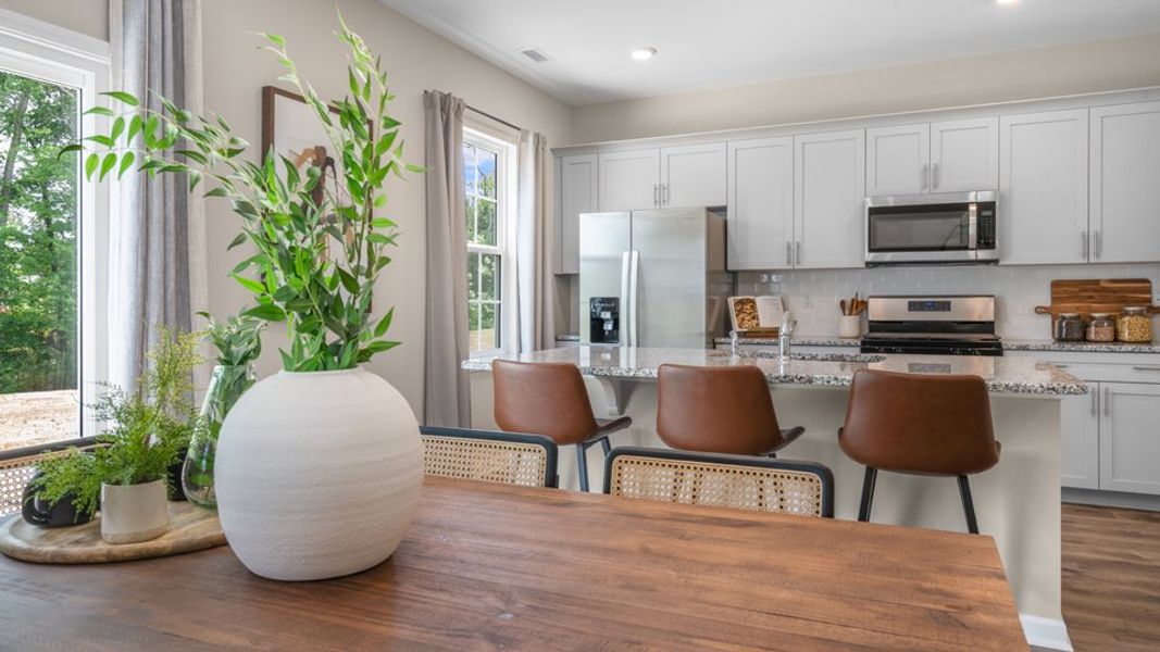 Furnished interior view inside a new home in The Preserve at Kinsley, Jamestown (Image 8).
