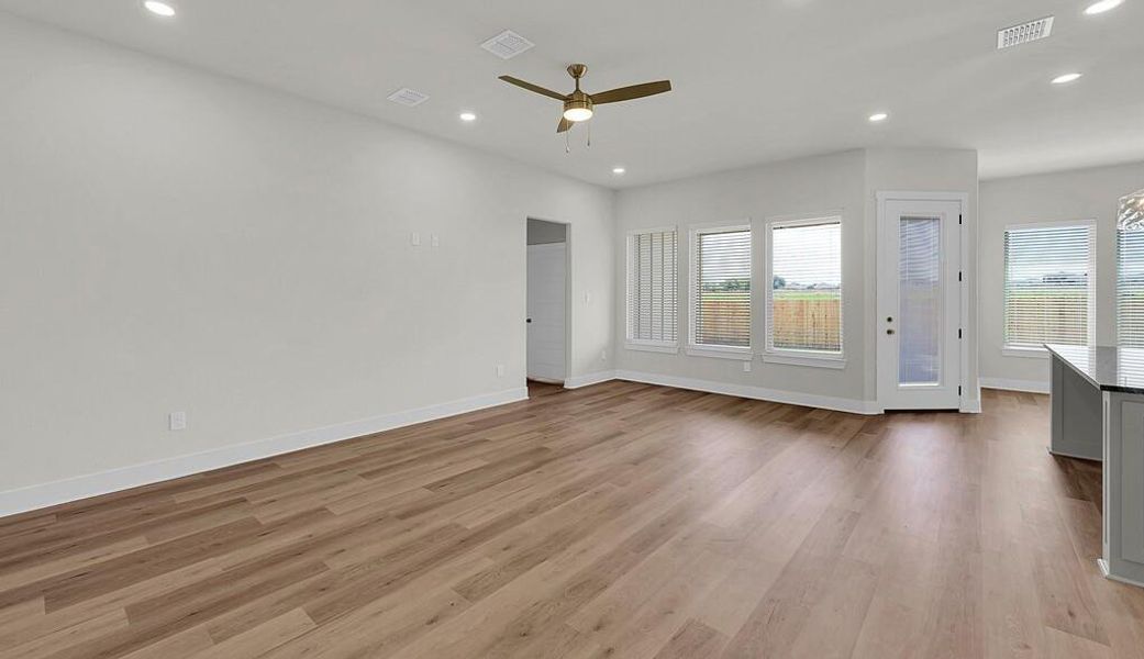 Unfurnished living room with recessed lighting, light wood-style floors, and a ceiling fan