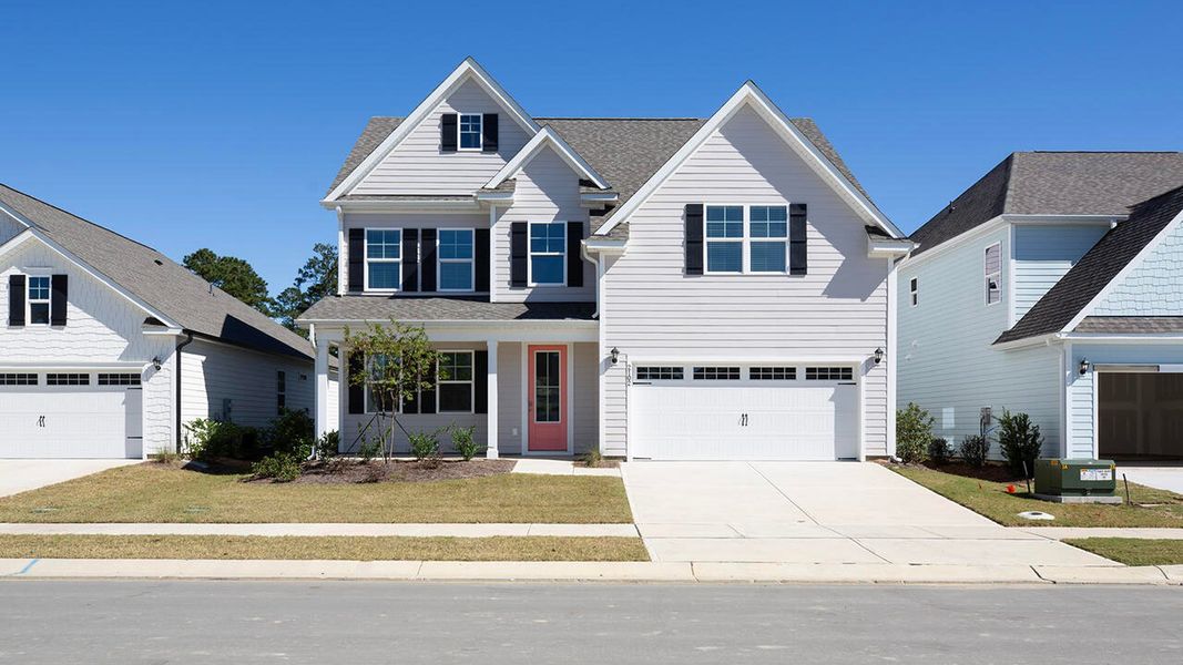 Front exterior of a new home in Indigo Preserve, Leland, NC, highlighting curb appeal (Image 1).