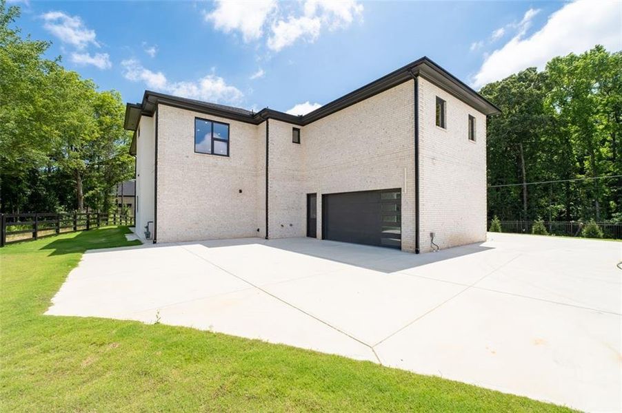 Front exterior of a new home in , Lawrenceville, GA, highlighting curb appeal (Image 25). Front exterior of a new home in , Lawrenceville, GA, highlighting curb appeal (Image 25).