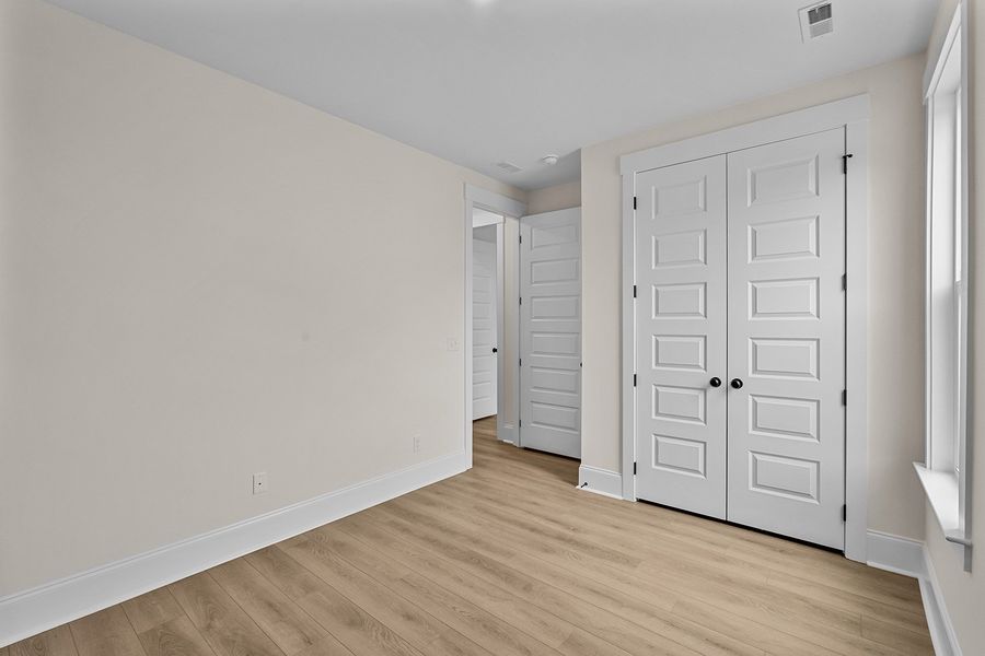 Spacious, unfurnished interior of a new home in Lilah Grove, Summerfield (Image 40).