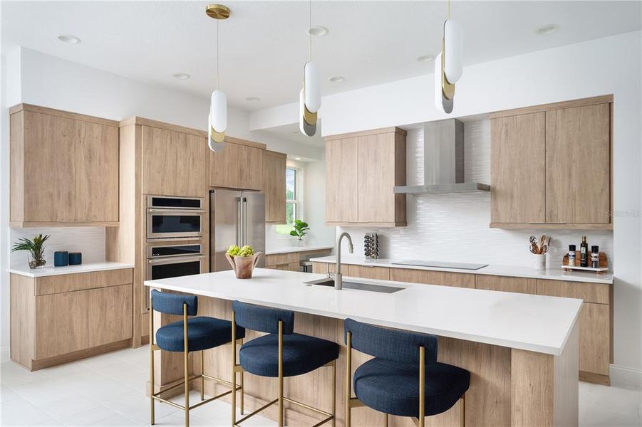 Kitchen of previously built Veranda Model home. Note: color selections and cabinet style may vary in this preconstruction home.