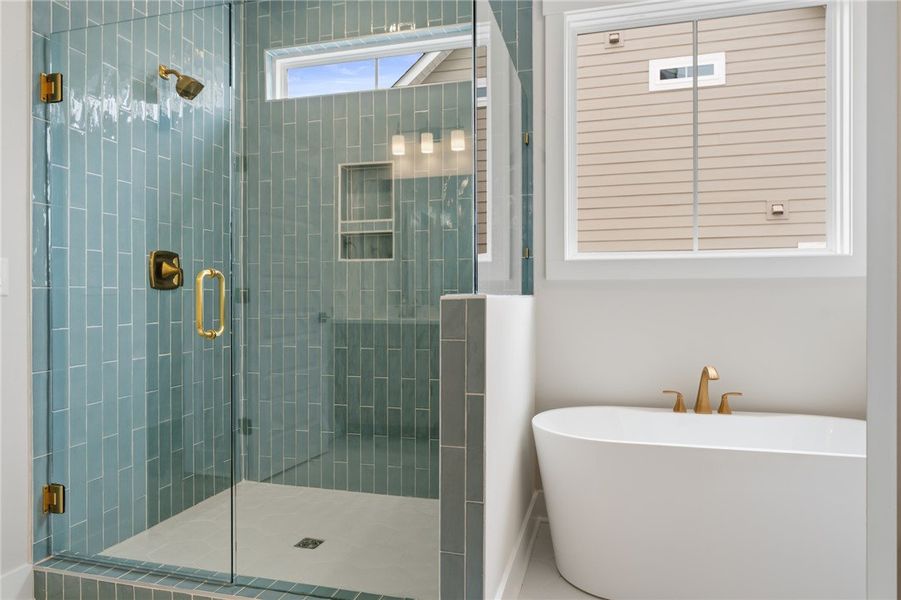 This primary bathroom features a freestanding tub