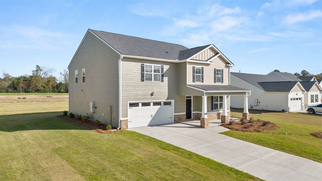 Front exterior of a new home in Southwind Village, Evans, GA, highlighting curb appeal (Image 20).