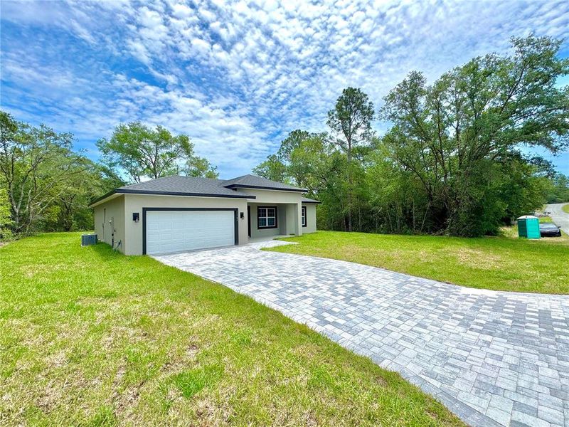 Front exterior of a new home in , Citrus Springs, FL, highlighting curb appeal (Image 17).