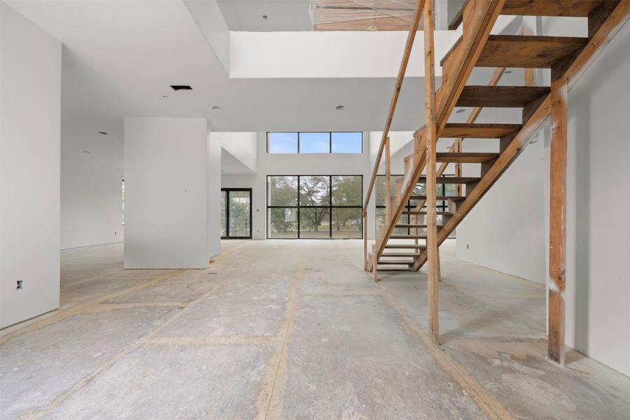 Entry way with 26 foot ceiling with clear sight line from front to back of the home.
