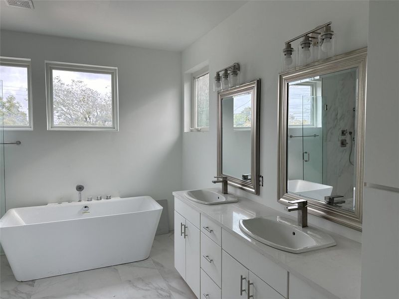 Primary Bath, vanity and jetted tub.