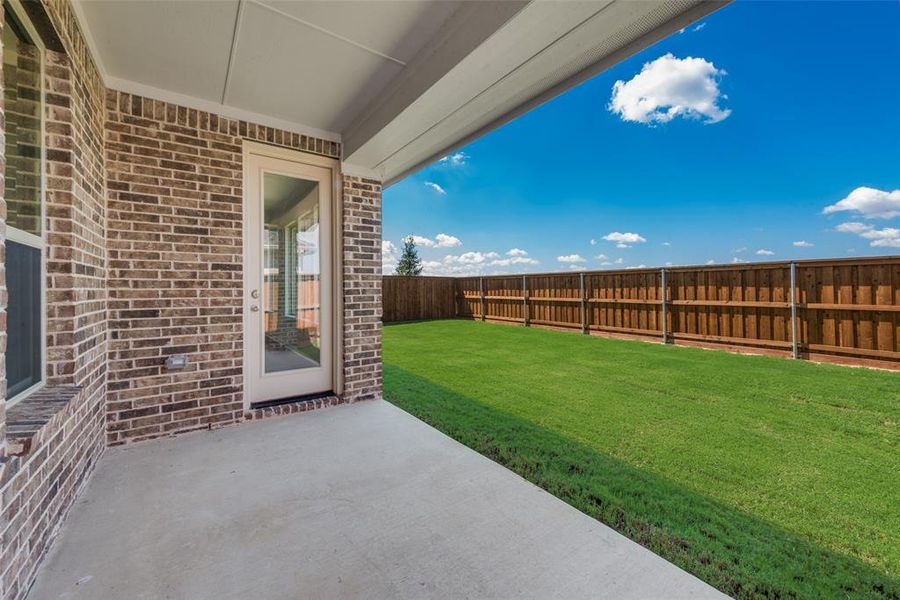 Exterior details and patio area of a home in Spiritas Ranch, Little Elm (Image 2).