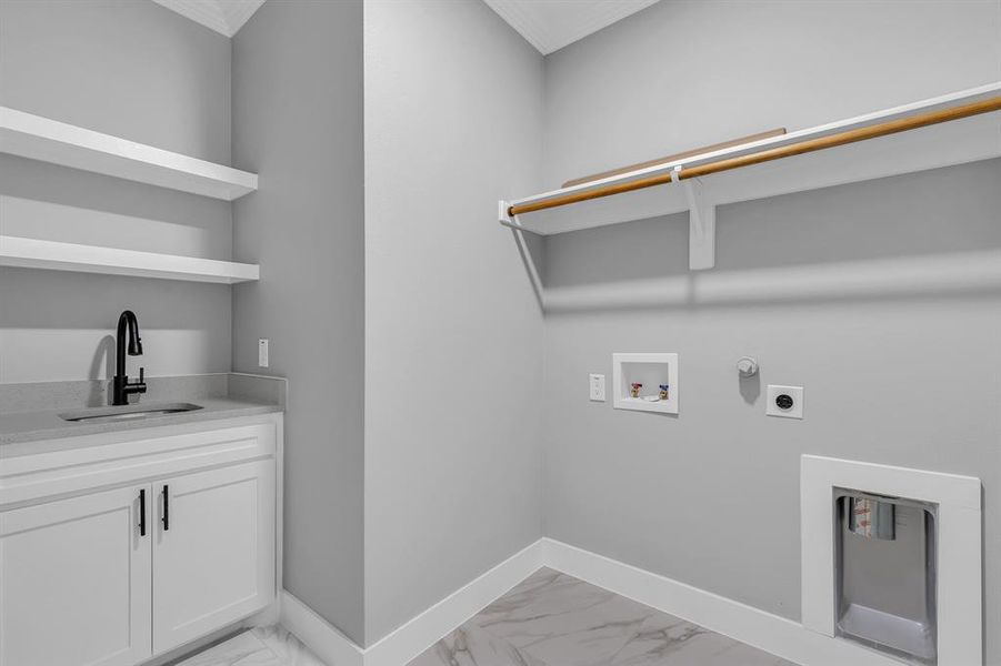 Laundry area with sink, cabinets, washer hookup, electric dryer hookup, and ornamental molding