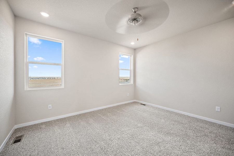 Spacious, unfurnished interior of a new home in Ridge at Lorson Ranch, Colorado Springs (Image 23).