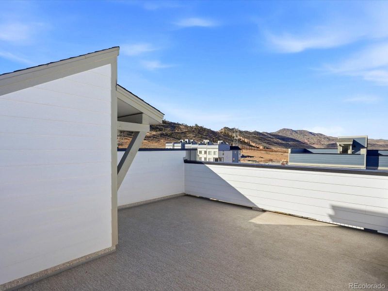Exterior details and patio area of a home in Three Hills, Morrison (Image 3).