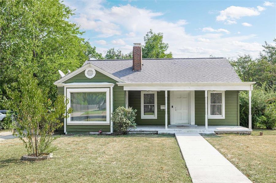 Bungalow-style house with covered porch, a front yard, a chimney, and roof with shingles Bungalow-style house with covered porch, a front yard, a chimney, and roof with shingles