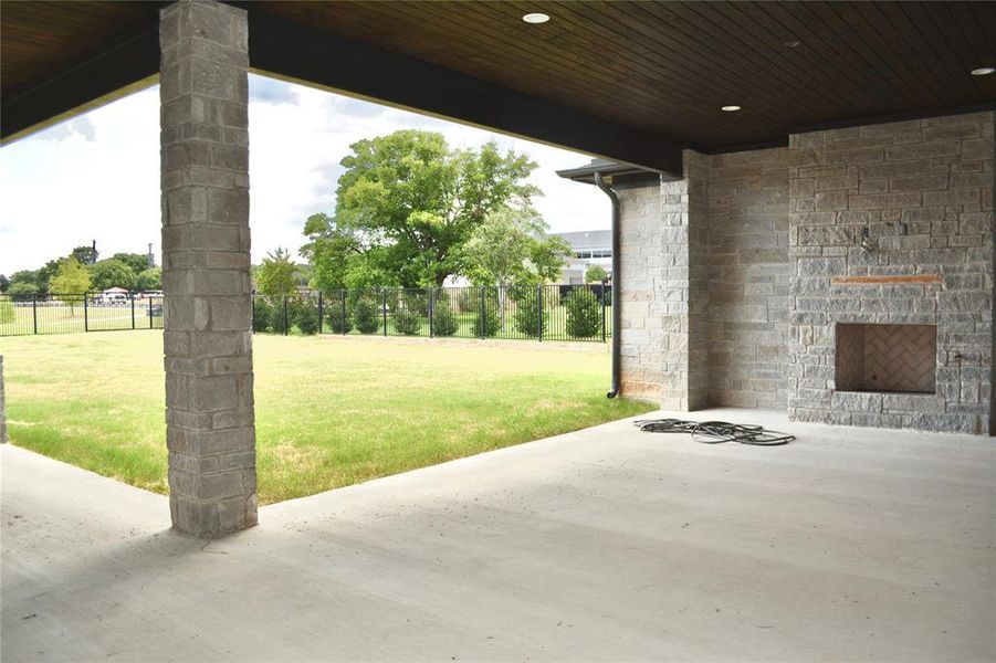 View of patio with a fireplace