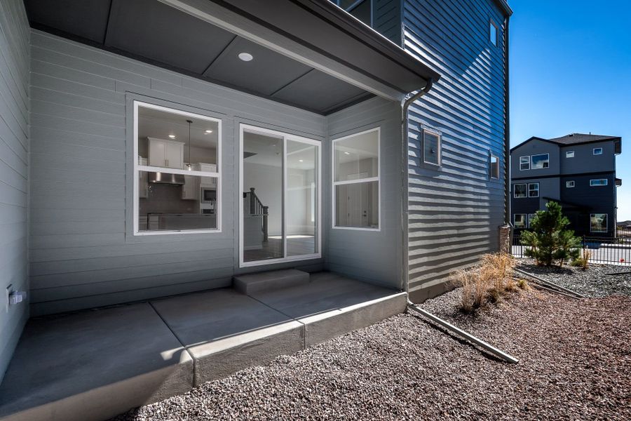 Exterior details and patio area of a home in Elevate at Wolf Ranch, Colorado Springs (Image 3).