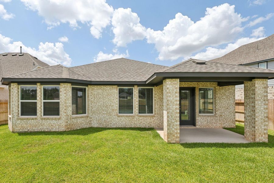 Front exterior of a new home in Kingdom Heights, Rosenberg, TX, highlighting curb appeal (Image 23). Front exterior of a new home in Kingdom Heights, Rosenberg, TX, highlighting curb appeal (Image 23).