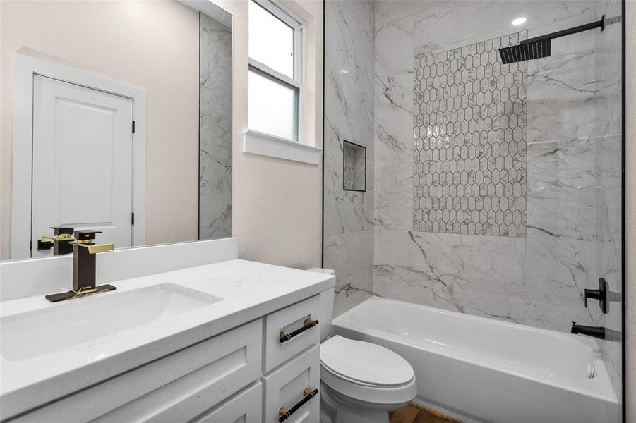 Bedroom #3 private bath with tub/shower combo and plenty of storage in the vanity.