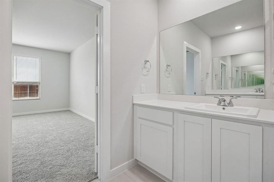 Primary Bathroom in the Masters home plan by Trophy Signature Homes – REPRESENTATIVE PHOTO