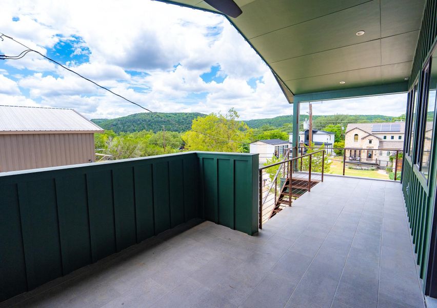 Side balcony of house: An inviting covered patio offers relaxed outdoor living. Side balcony of house: An inviting covered patio offers relaxed outdoor living.