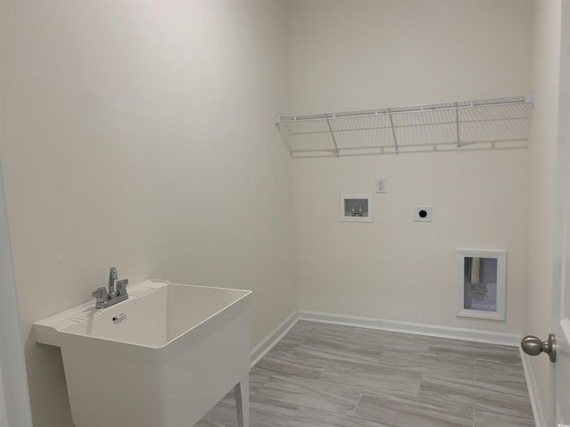 Laundry room featuring hookup for an electric dryer and washer hookup