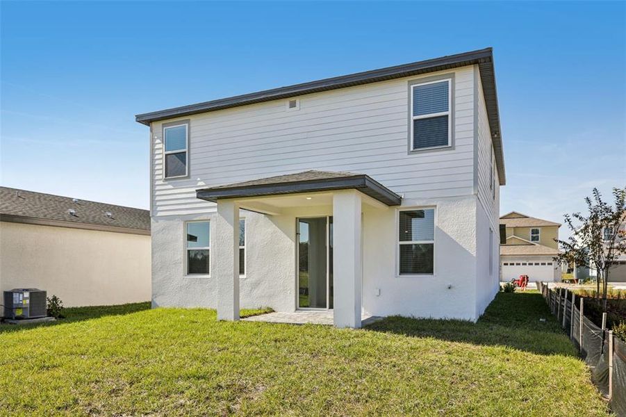 Exterior details and patio area of a home in The Reserve at Hammock Oaks - Classic Series, Lady Lake (Image 24).