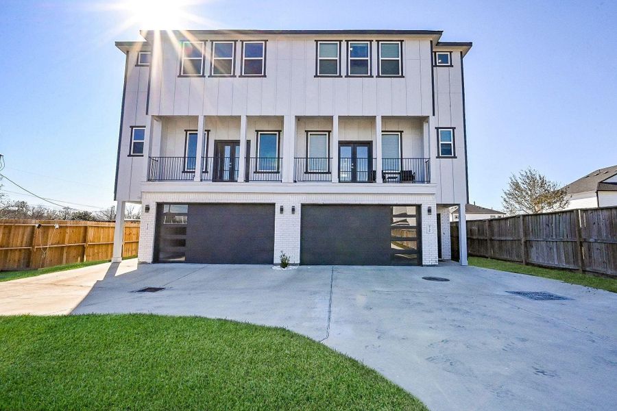 Beautiful contemporary multi-plex with spacious driveway and inviting front elevation.