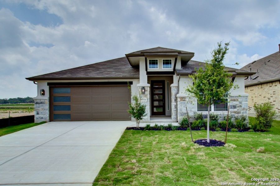 Front exterior of a new home in Veranda, San Antonio, TX, highlighting curb appeal (Image 1).