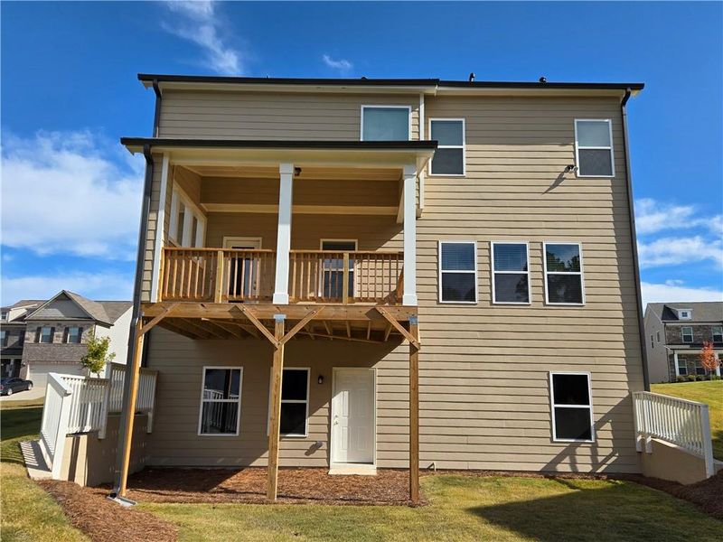 Exterior details and patio area of a home in Enclave at Logan Point, Loganville (Image 4).