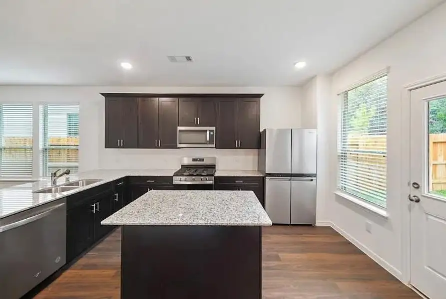 Furnished interior view inside a new home in The Pines At Seven Coves, Conroe (Image 4).
