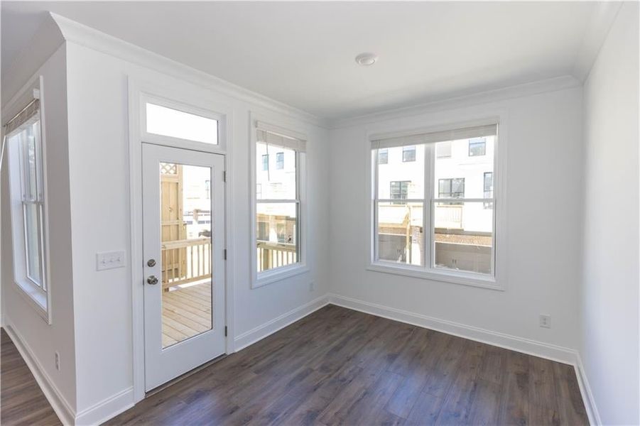 The sunroom opens to the deck*Photo of model home in a different community. Used for illustrative purposes only*