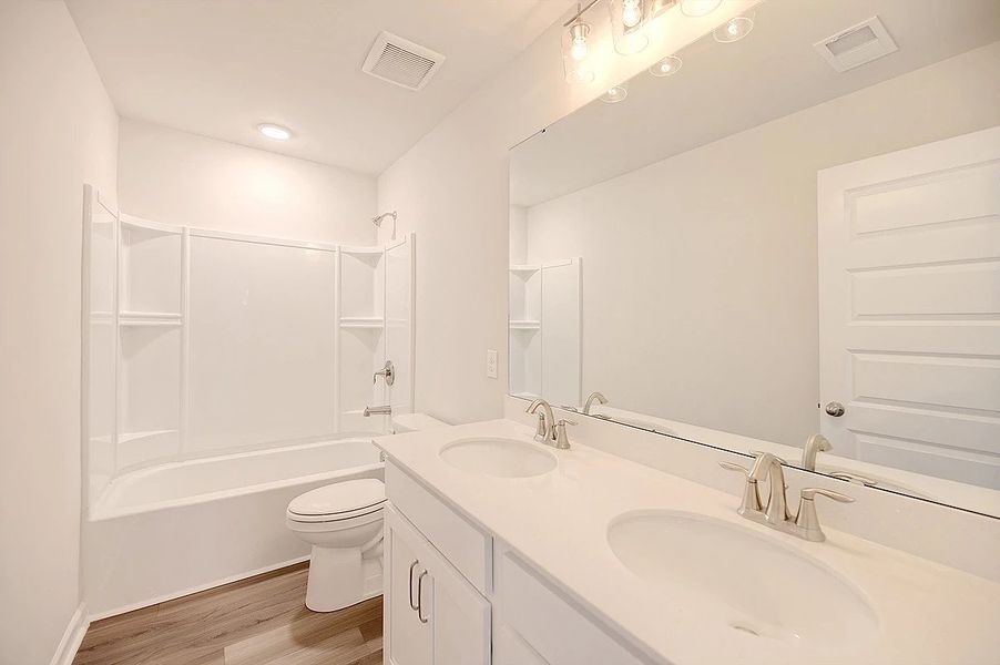 Representative furnished interior of a home built from the Monroe by Ashton Woods in Watson Hill, Summerville (Image 18). Representative furnished interior of a home built from the Monroe by Ashton Woods in Watson Hill, Summerville (Image 18).