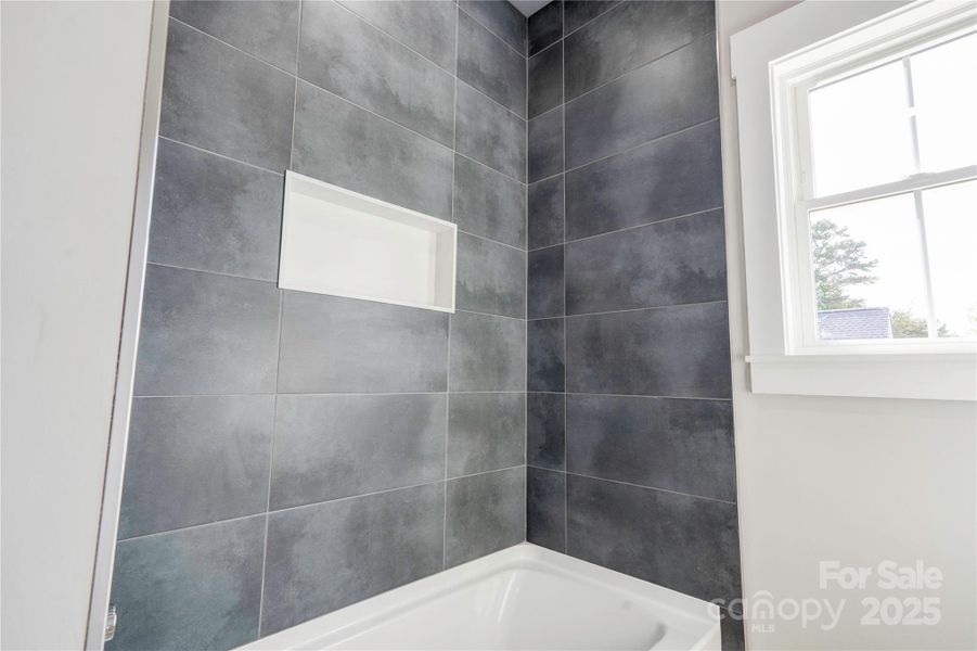 Custom Tile in hallway full bath