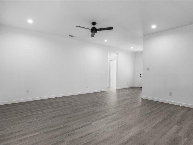 Spare room featuring hardwood / wood-style floors and ceiling fan