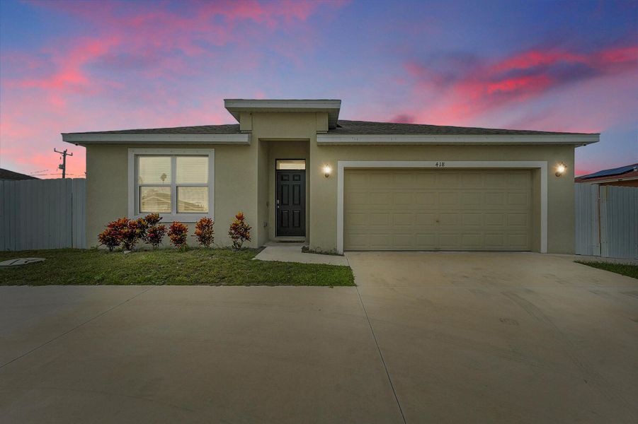 Front exterior of a new home in , Port St. Lucie, FL, highlighting curb appeal (Image 27).